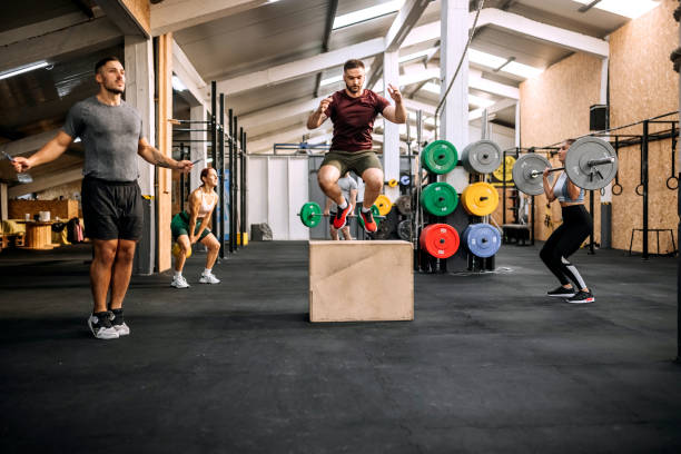 Group of athletes working out together in a gym